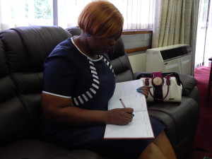 Energy and Water Development Minister Honourable Dora Siliya signs the Visitors' Book at the Zambian High Commission in Pretoria on 13th January, 2016