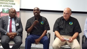 Lusaka Province Minister, Mr. Japhen Mwakalombe (centre) speaking during a panel discussion at the symposium in Pretoria on Wednesday, 19th October, 2016. With him are Agri-Zambia Board Member Mr. Levi Tembo, and AaA Chairperson Dr. Theo De Jager